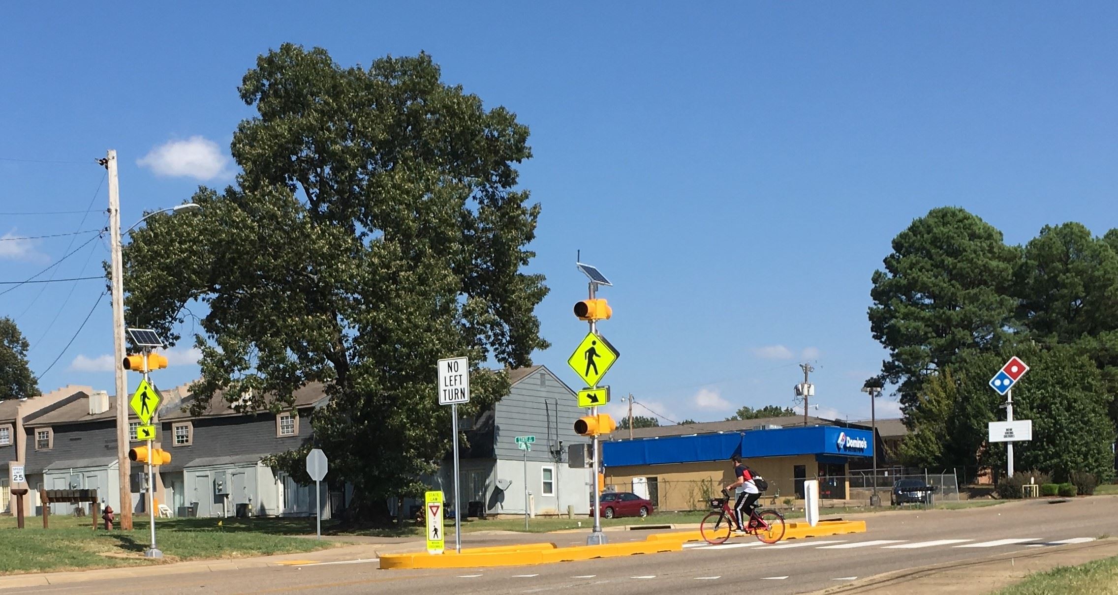 Cyclist at Highway 91 temporary pedestrian crossing Opens in new window